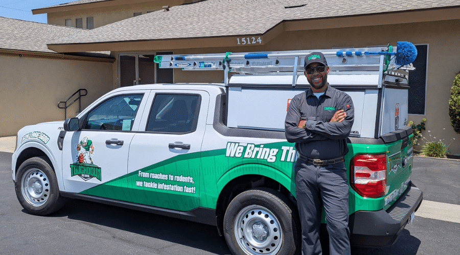 Touchdown Pest Control truck and technician offering free pest inspections in West Covina.